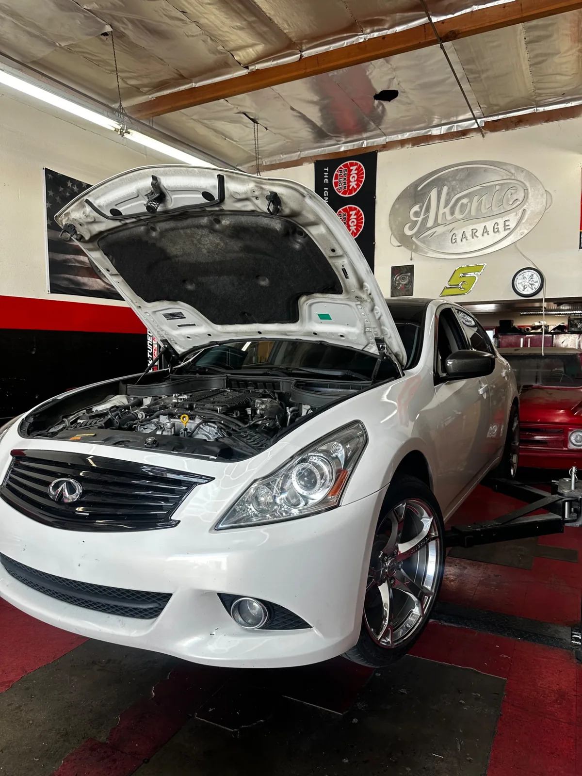 White Infiniti at Akonic Garage